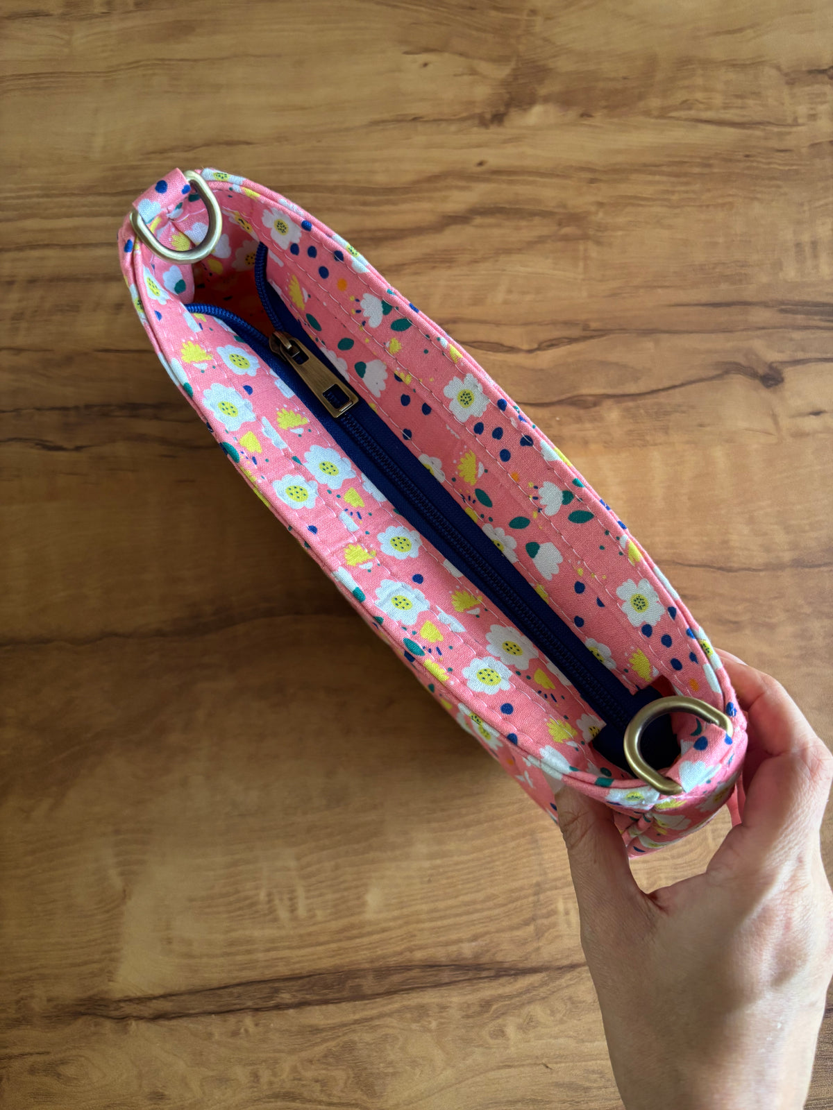 Pink Daisy Quilted Baguette Bag from the top, showing the navy zip