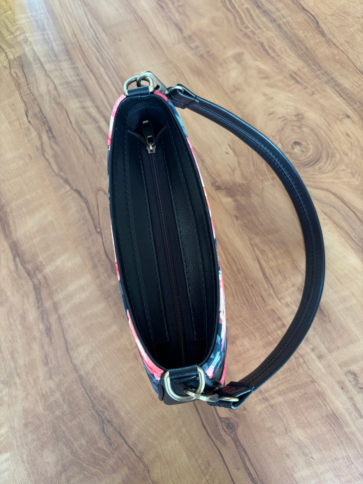Night Garden Baguette Bag from the top, showing the zip and the black strap