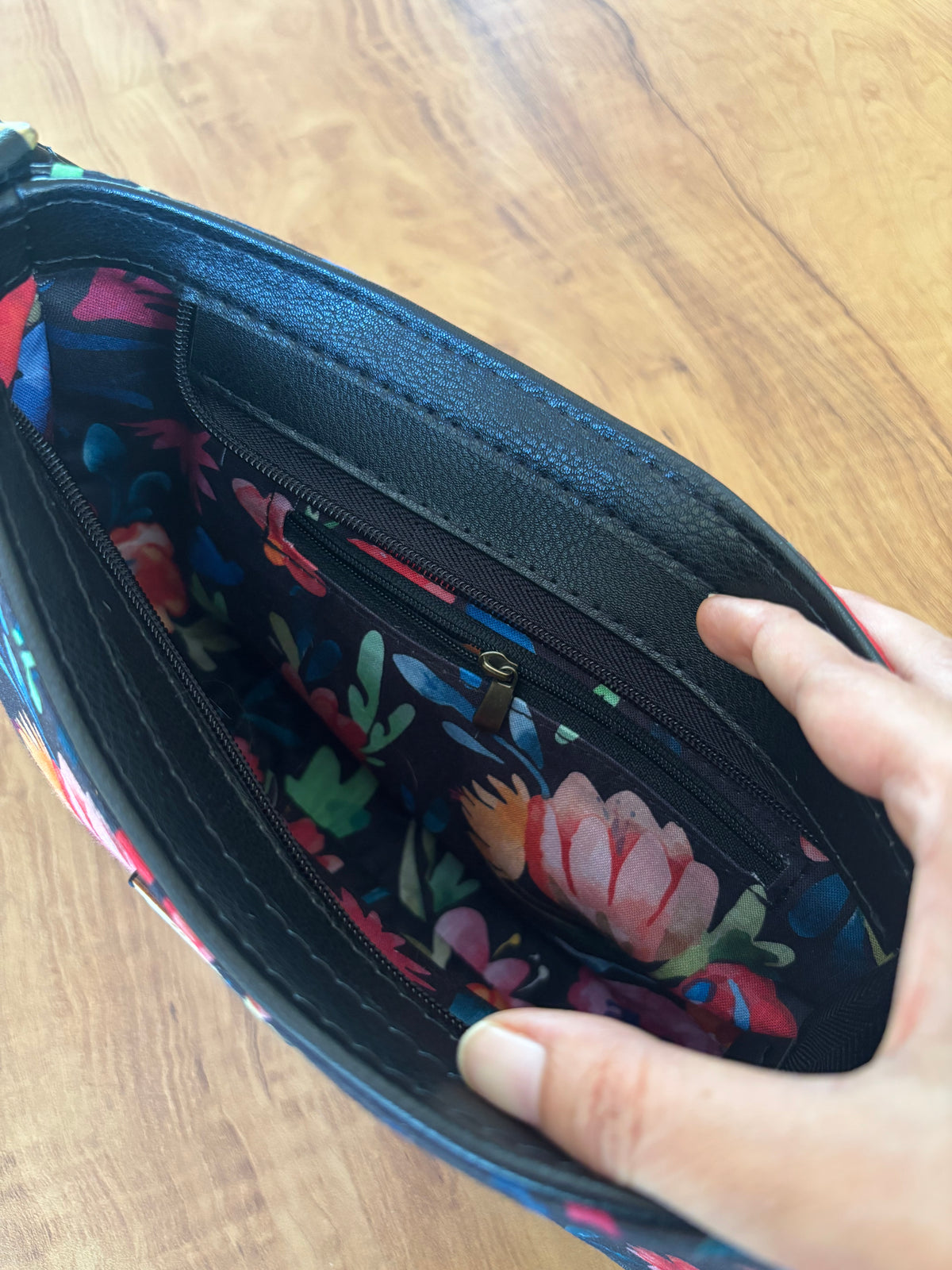 Inside the Night Garden Baguette Bag: lined in the same flower print, with a black faux leather panel