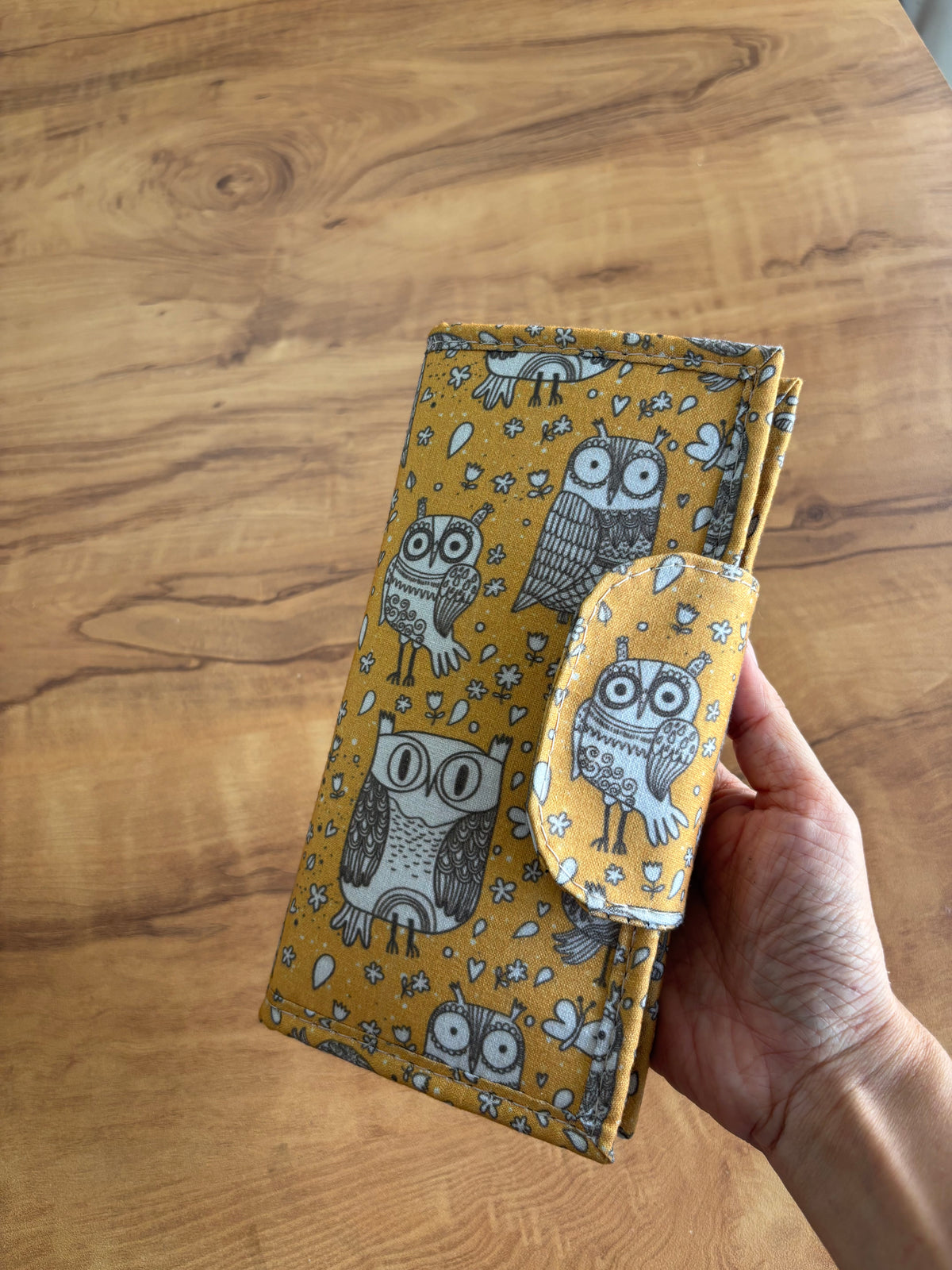 Owl Print Everyday Wallet, closed, held in a hand