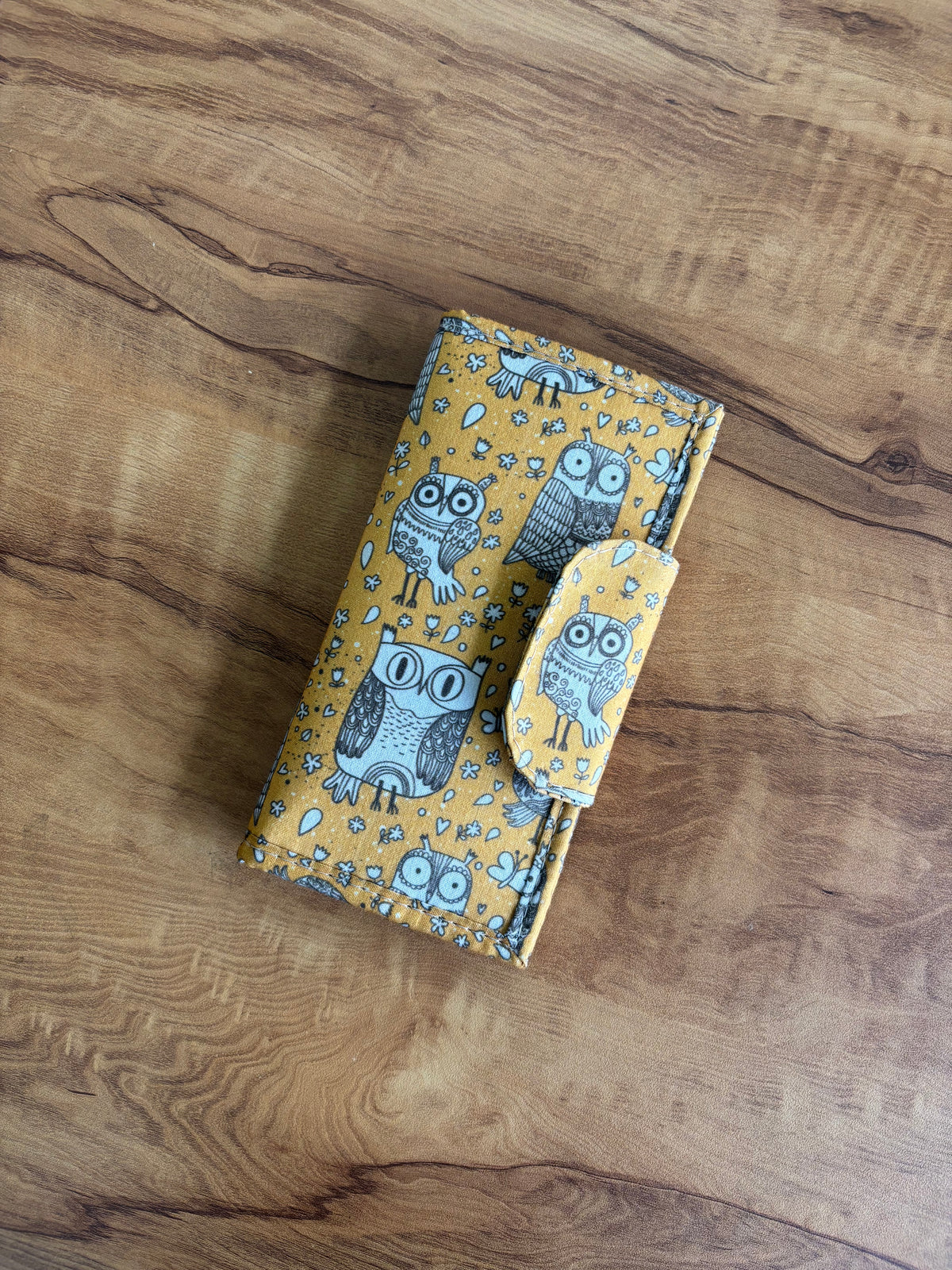 Owl Print Everyday Wallet on a wooden table